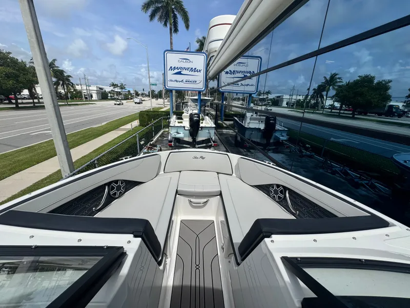 Slide: The Image of Sea Ray SPX 210 Outboard 2026: Sleek design with comfortable seating and modern speakers. - 16