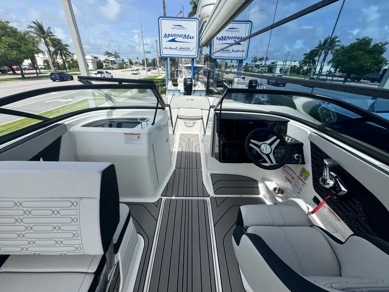 Slide: The Image of Interior view of a Sea Ray SPX 210 Outboard with modern seating and helm console. - 14