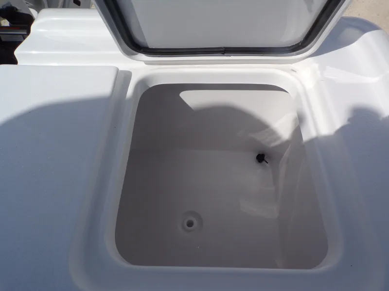 Slide: The Image of Open storage compartment in 2026 Tidewater 2500 Carolina Bay boat. - 11