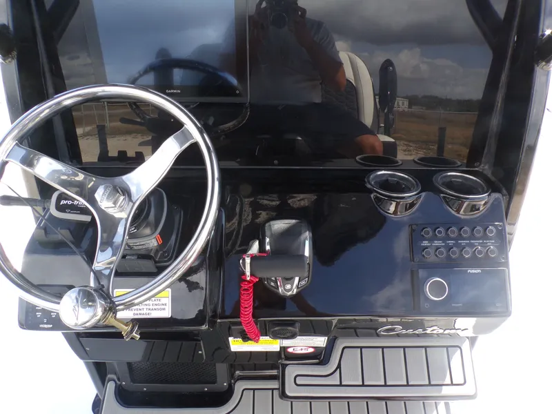 Slide: The Image of Dashboard of 2026 Tidewater 2500 Carolina Bay with steering wheel and controls. - 35