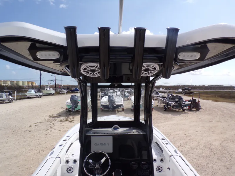 Slide: The Image of Tidewater 2500 Carolina Bay 2026 boat with Garmin equipment, parked outdoors. - 40
