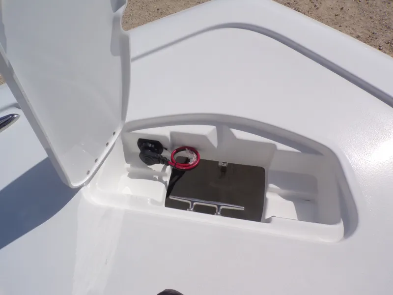 Slide: The Image of Tidewater 2500 Carolina Bay 2026 boat storage compartment with open lid. - 6