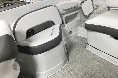 Slide: The Image of 2024 Crownline Eclipse E240 XS boat interior with gray and white seating. - 10