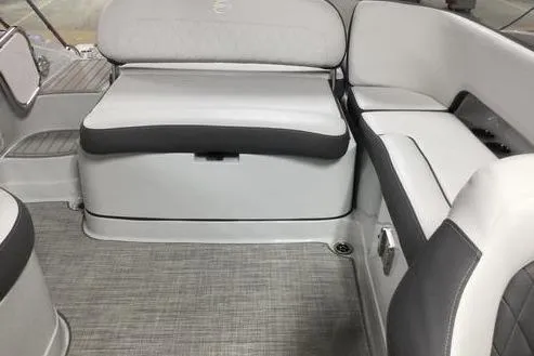 Slide: The Image of 2024 Crownline Eclipse E240 XS boat interior with gray and white seating. - 11