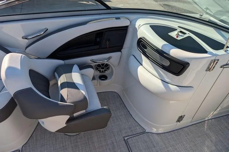 Slide: The Image of 2024 Crownline Eclipse E240 XS boat interior with sleek seating and modern design. - 21
