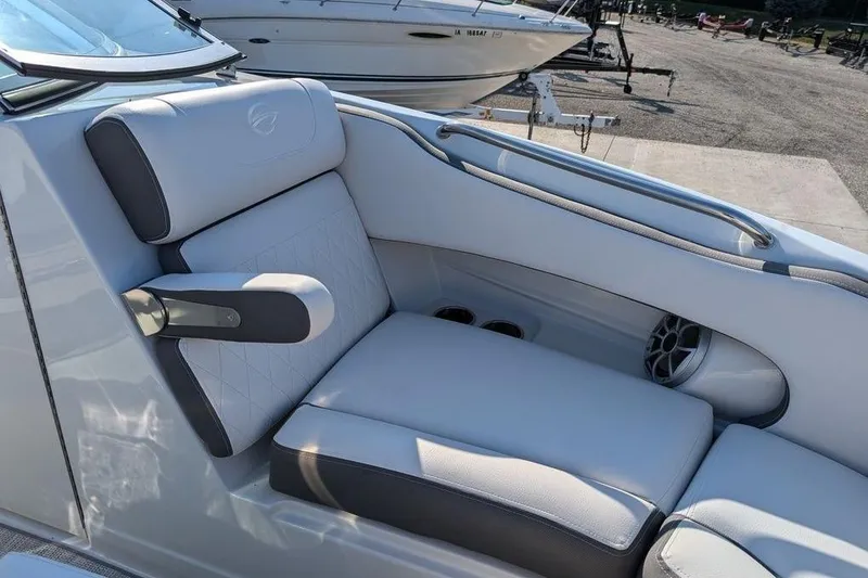 Slide: The Image of 2024 Crownline Eclipse E240 XS boat interior with luxurious seating and speaker system. - 23