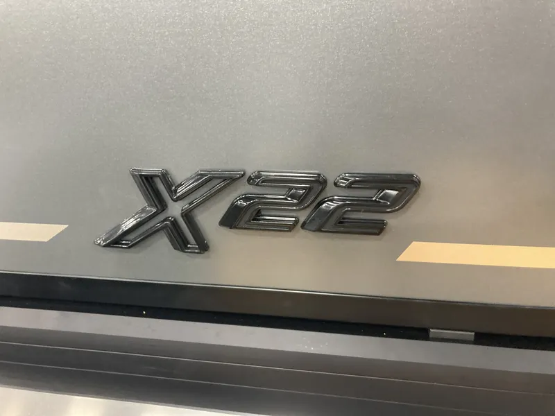 Slide: The Image of Viaggio X22Q 2026 emblem on silver background. - 19