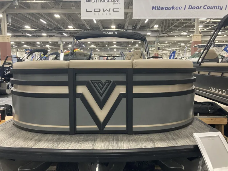 Slide: The Image of Viaggio X22Q 2026 pontoon boat at a boat show. - 2