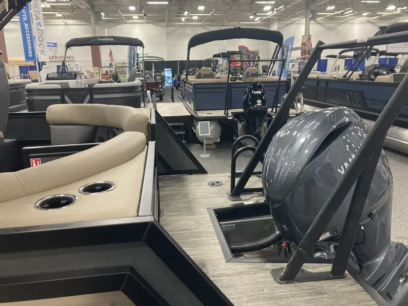 Slide: The Image of Viaggio X22Q 2026 pontoon boat displayed at a trade show. - 7