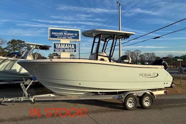 The Image of 2026 Robalo R230 Center Console boat on trailer, in stock at Angler's Marine. - 1