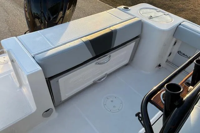 Slide: The Image of 2026 Robalo R230 Center Console boat interior with seating and storage compartments. - 13