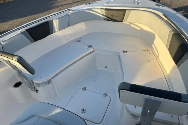 Slide: The Image of 2026 Robalo R230 Center Console boat interior with spacious seating and storage compartments. - 5