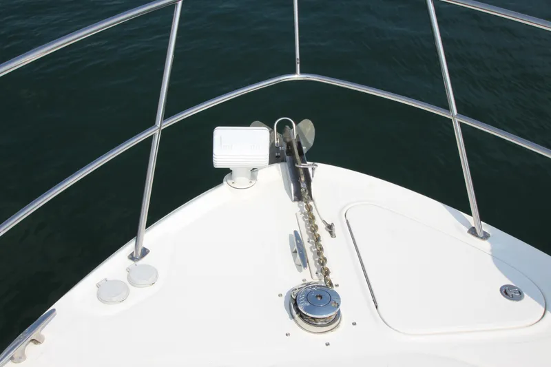 Slide: The Image of Bow of 2004 Sea Ray 40 Sundancer yacht with anchor and railing. - 16