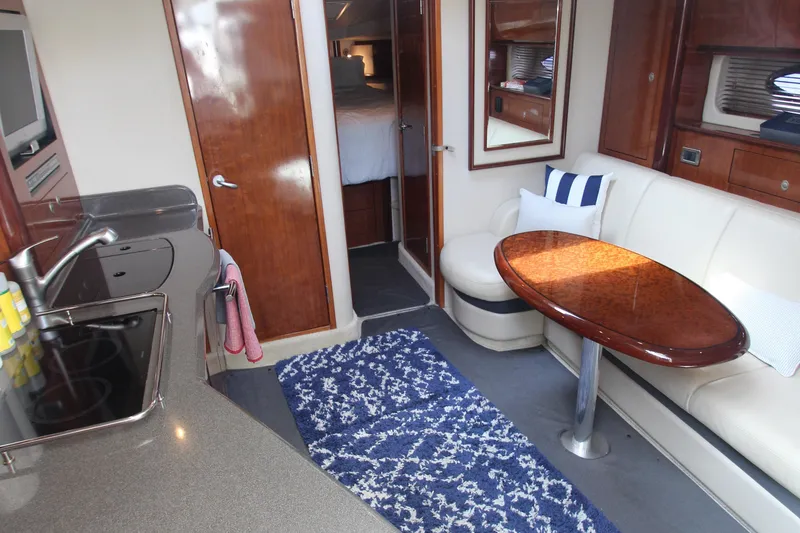 Slide: The Image of Luxurious 2004 Sea Ray 40 Sundancer interior with elegant seating and modern amenities. - 33