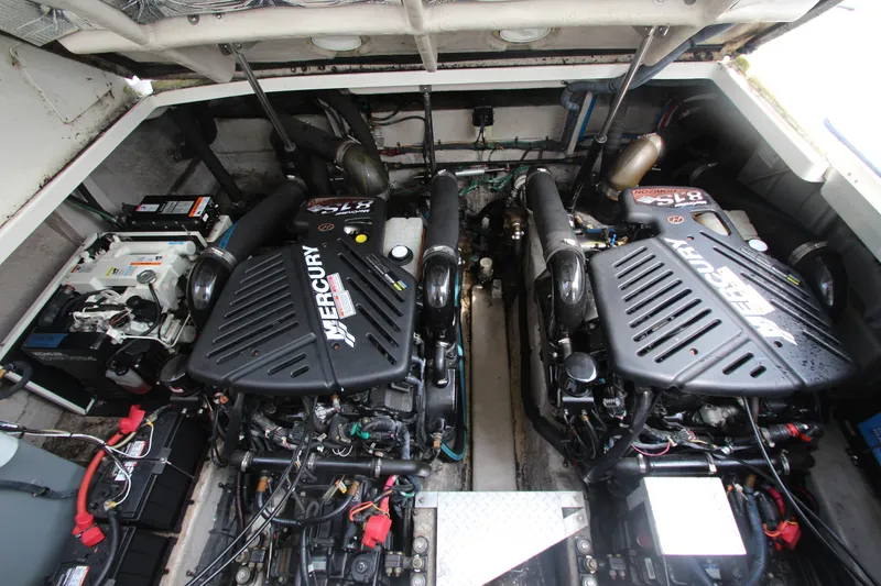 Slide: The Image of Engine room of 2004 Sea Ray 40 Sundancer with twin Mercury engines. - 52