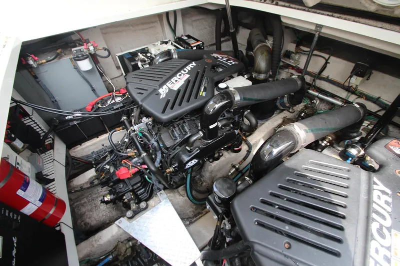 Slide: The Image of Engine compartment of a 2004 Sea Ray 40 Sundancer with Mercury engines. - 55