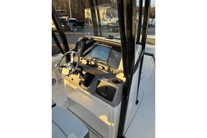 Slide: The Image of 2026 Robalo R230 Center Console helm with modern electronics. - 10