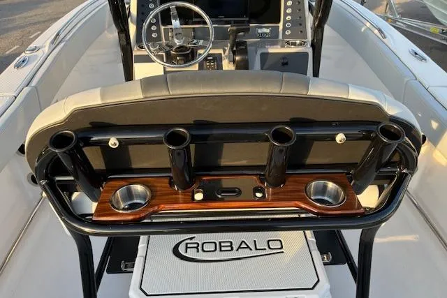 Slide: The Image of 2026 Robalo R230 Center Console with rod holders and helm. - 14