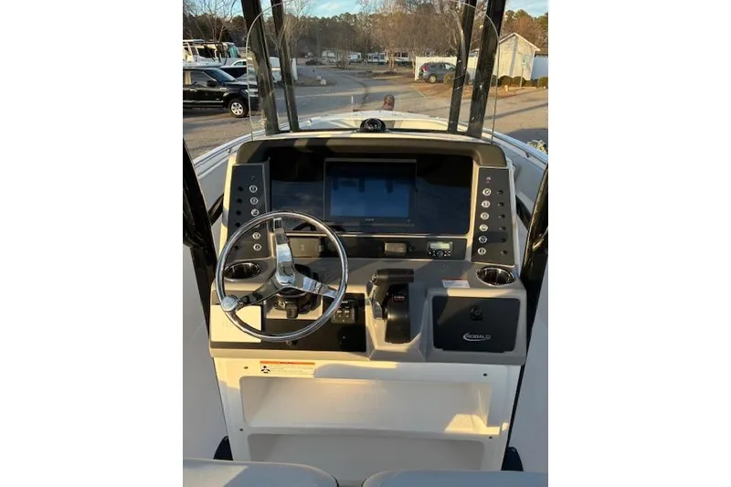 Slide: The Image of 2026 Robalo R230 Center Console helm with modern electronics. - 11
