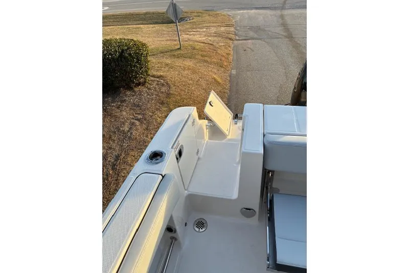 Slide: The Image of Robalo R230 Center Console 2026, boat deck view, open hatch. - 20