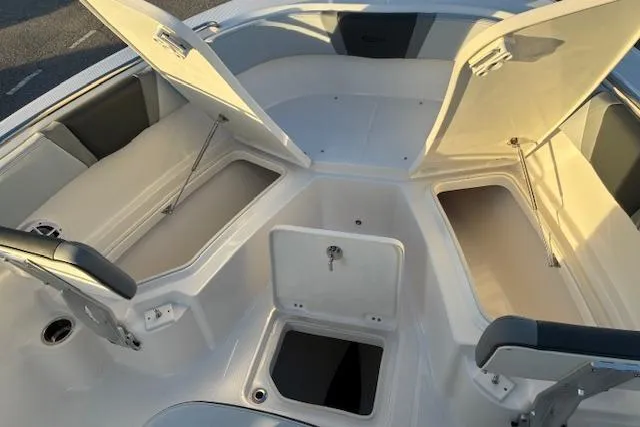 Slide: The Image of 2026 Robalo R230 Center Console with open storage compartments. - 6