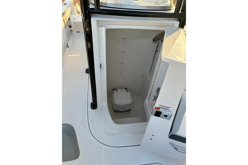 Slide: The Image of Interior of 2026 Robalo R230 Center Console with toilet. - 8