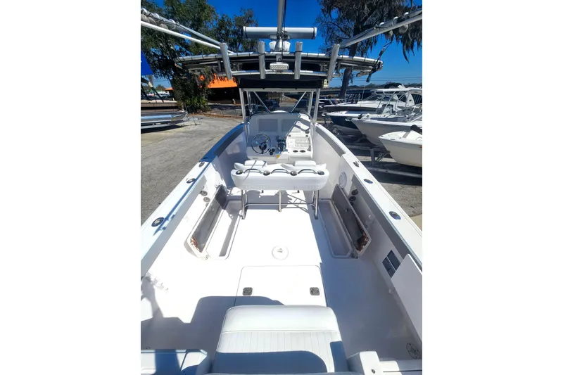 Slide: The Image of 2006 Donzi 32 ZF boat interior with white seating and steering console. - 12