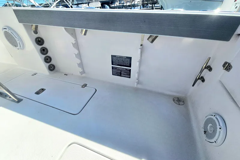 Slide: The Image of 2006 Donzi 32 ZF boat interior with speakers and storage compartments. - 15