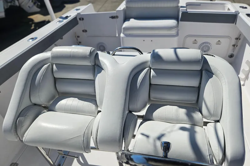 Slide: The Image of 2006 Donzi 32 ZF boat interior with plush white seating and sleek design. - 18