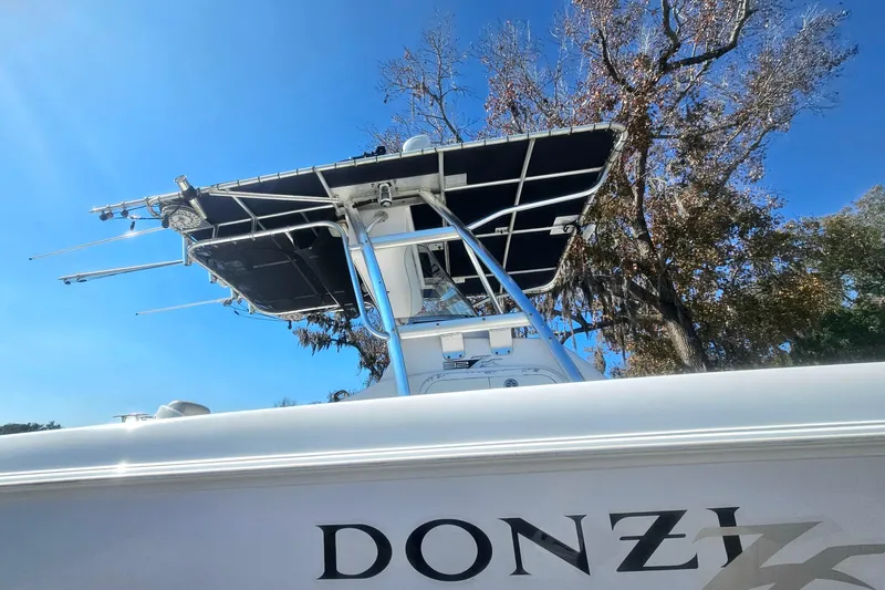 Slide: The Image of 2006 Donzi 32 ZF boat with T-top against clear blue sky. - 2