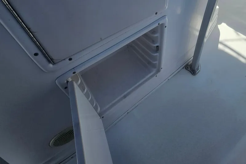 Slide: The Image of Open storage compartment on a 2006 Donzi 32 ZF boat. - 36