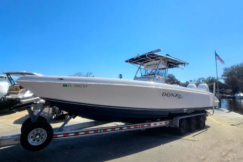 Slide: The Image of 2006 Donzi 32 ZF boat on trailer, clear sky background. - 6