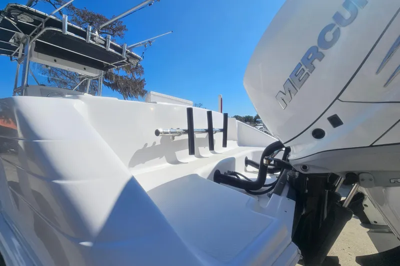 Slide: The Image of 2006 Donzi 32 ZF boat with Mercury engine, viewed from the rear under a clear blue sky. - 7