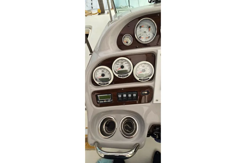Slide: The Image of Dashboard of 2006 Chaparral Signature 310 boat with gauges and controls. - 11
