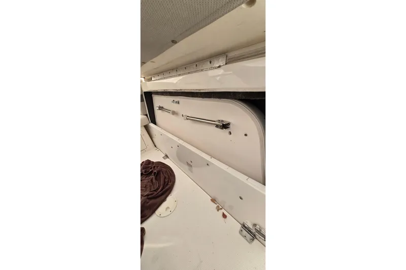 Slide: The Image of 2006 Chaparral Signature 310 boat interior storage compartment. - 4