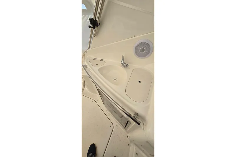 Slide: The Image of 2006 Chaparral Signature 310 boat interior with sink and speaker. - 6