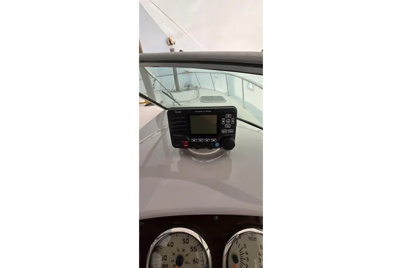 Slide: The Image of 2006 Chaparral Signature 310 dashboard with radio and gauges. - 9