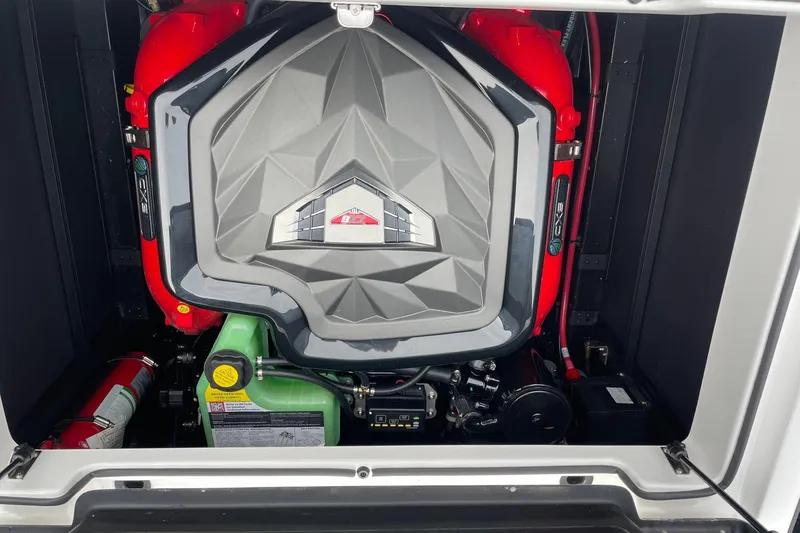 Slide: The Image of Engine compartment of 2026 Nautique Super Air Nautique GS24 boat. - 13