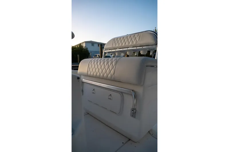 Slide: The Image of 2005 Contender 27 Tournament boat seat with quilted upholstery and storage compartment. - 10