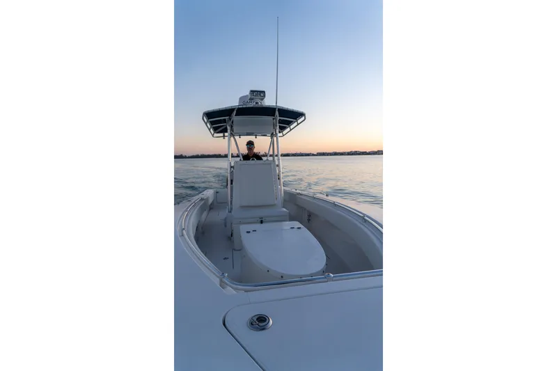 Slide: The Image of 2005 Contender 27 Tournament boat on calm water at sunset. - 26