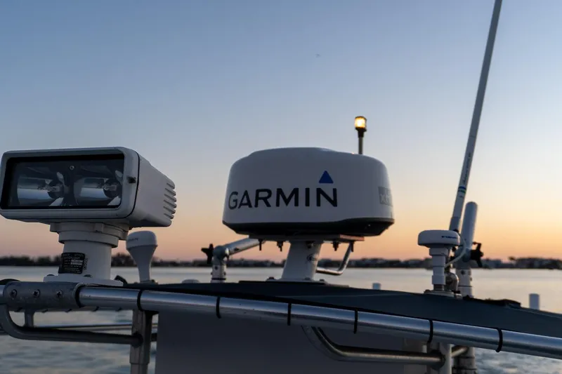 Slide: The Image of 2005 Contender 27 Tournament boat with Garmin radar at sunset. - 29