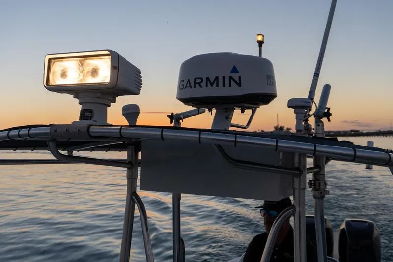 Slide: The Image of 2005 Contender 27 Tournament boat with Garmin radar and spotlight at sunset. - 30