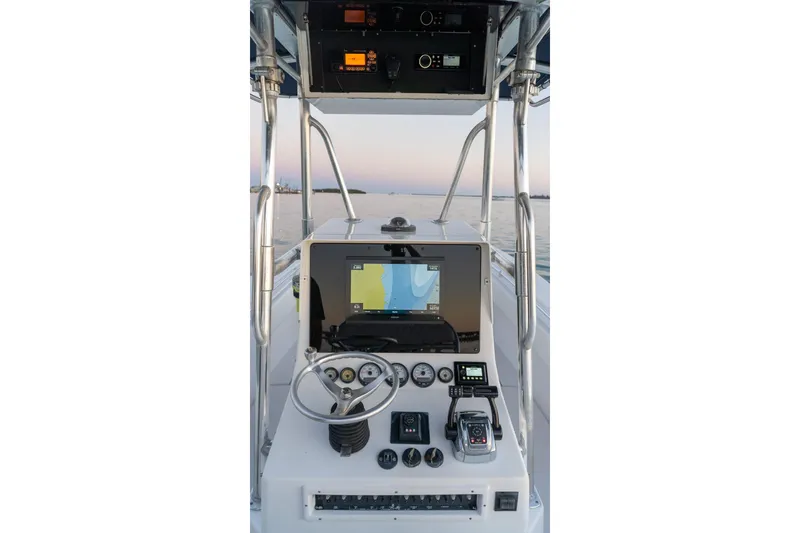Slide: The Image of Center console of a 2005 Contender 27 Tournament boat with navigation equipment. - 33