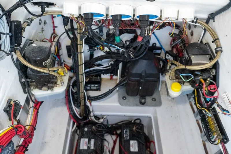 Slide: The Image of Electrical wiring and components inside a 2005 Contender 27 Tournament boat. - 37