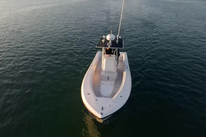 Slide: The Image of 2005 Contender 27 Tournament boat on calm water, aerial view. - 4