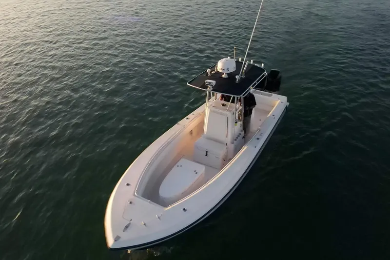 Slide: The Image of 2005 Contender 27 Tournament boat on calm water, aerial view. - 8