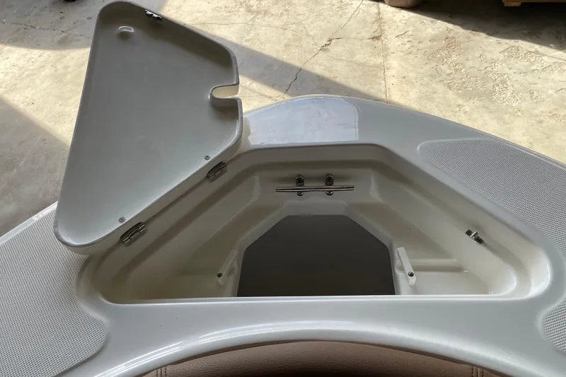 Slide: The Image of Open storage compartment on 2026 Pioneer 202 Islander boat, showcasing interior design. - 10