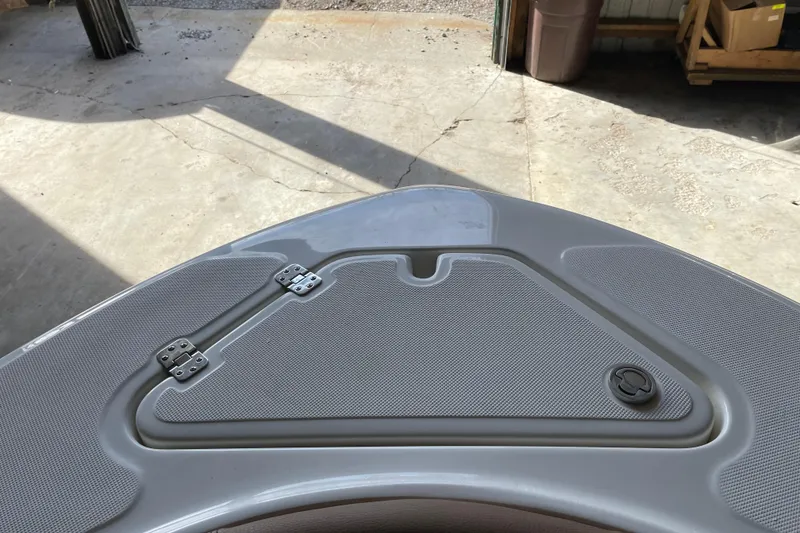 Slide: The Image of Bow of 2026 Pioneer 202 Islander boat with storage compartment and latch. - 11