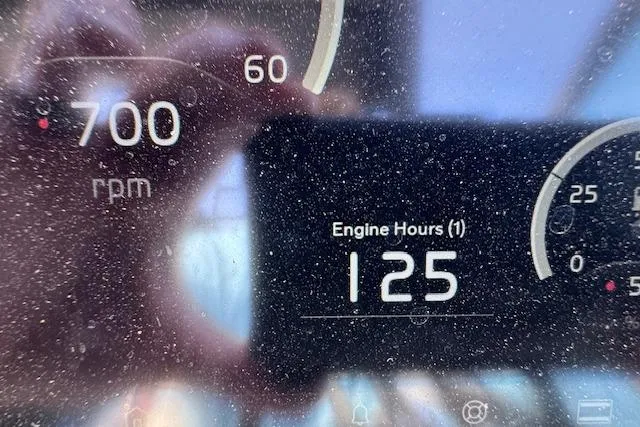 Slide: The Image of Dashboard of 2023 Regal 28 Express showing 700 RPM and 125 engine hours. - 21