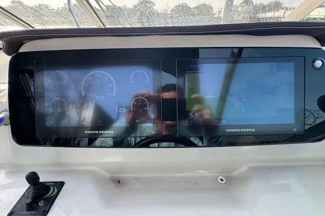 Slide: The Image of Dashboard of 2023 Regal 28 Express boat with dual Volvo Penta displays. - 22